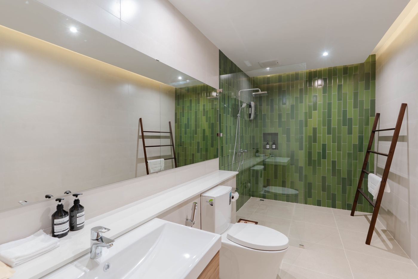 Bathroom with green tiled walk-in shower