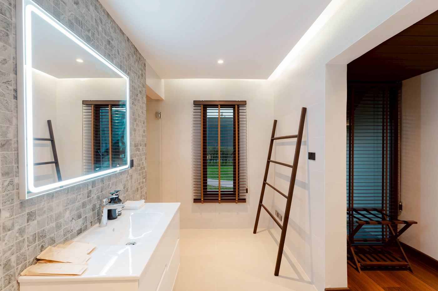 Bathroom with mosaic wall and garden window