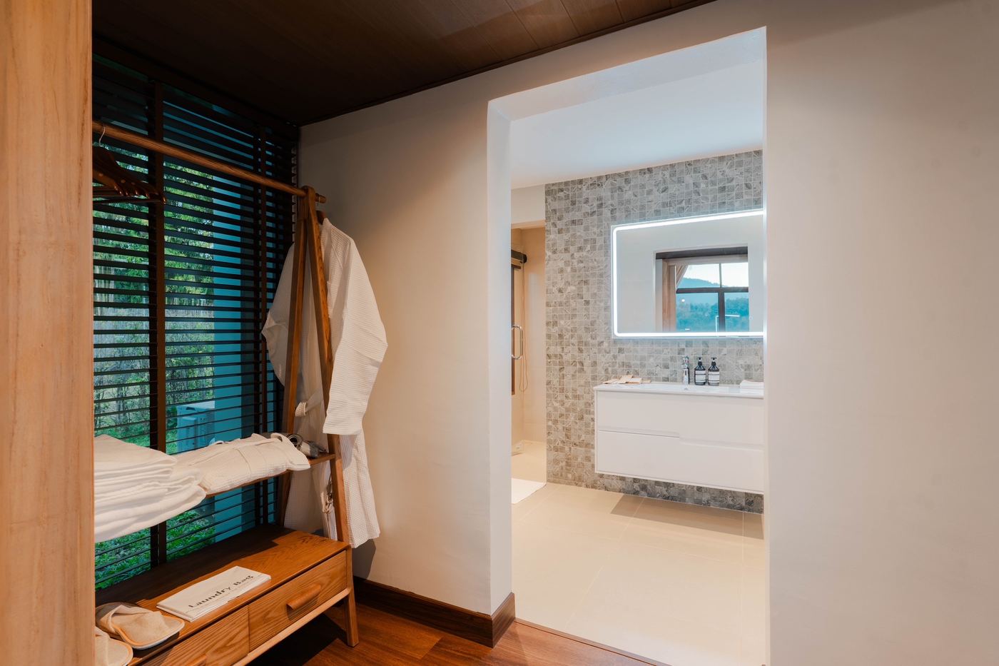 Robes and wardrobe beside the bathroom